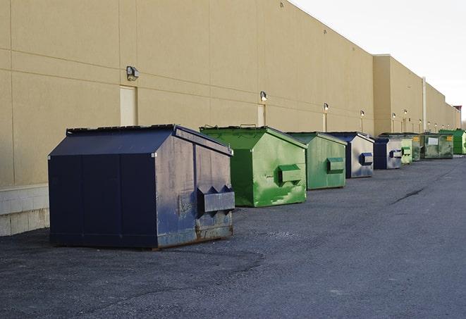 a pile of rugged and heavy-duty dump containers ready for construction waste in Huntsville